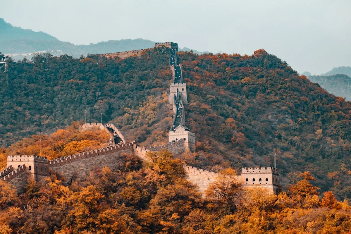 The Great Wall of China on a ridge under pale sky — illustrative imagery for Newsorga's coverage of China's May 11, 2026 confirmation of U.S. President Donald Trump's May 13-15 state visit to Beijing for talks with President Xi Jinping.