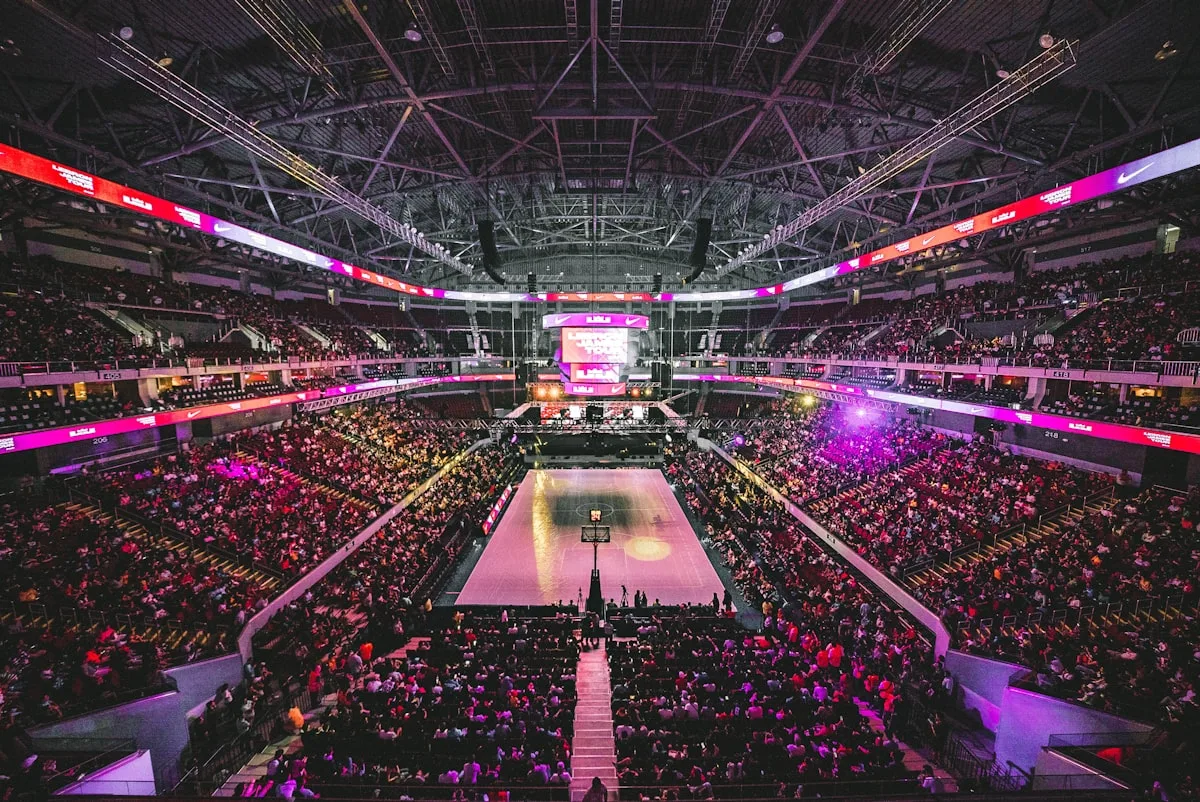 Players in motion on a brightly lit indoor basketball court — illustrative imagery for Newsorga's coverage of the Detroit Pistons' Game 4 injury report on Sunday, May 10, 2026, in which guards Kevin Huerter (left adductor) and Caris LeVert (right heel) were listed as questionable for the Monday, May 11 Eastern Conference semifinals matchup against the Cleveland Cavaliers at Rocket Mortgage FieldHouse.