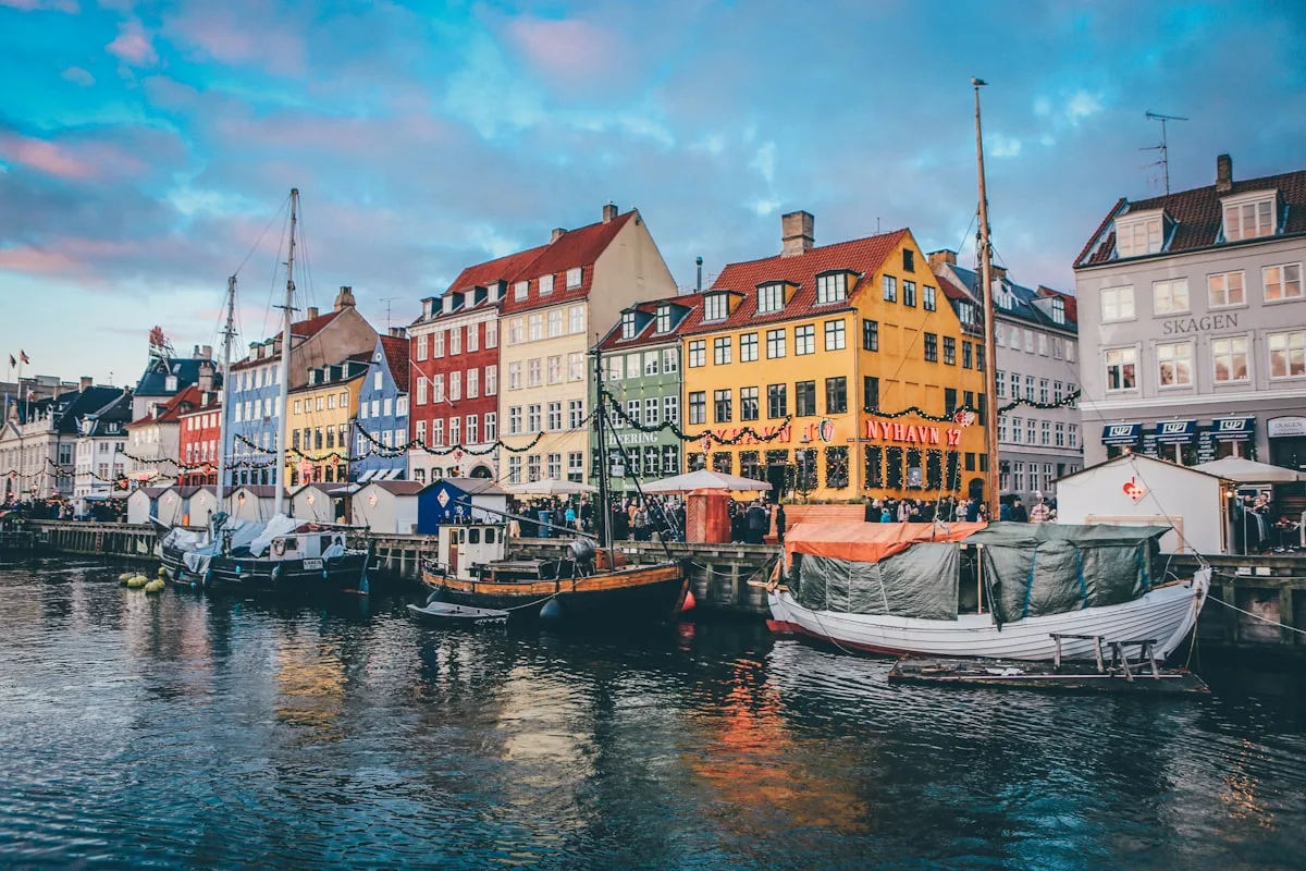 Colorful Nyhavn harbor in Copenhagen with traditional Danish facades, illustrative backdrop for the Nordic-led 2026 Global Social Progress Index in which Denmark, Norway and Finland again dominate the top tier