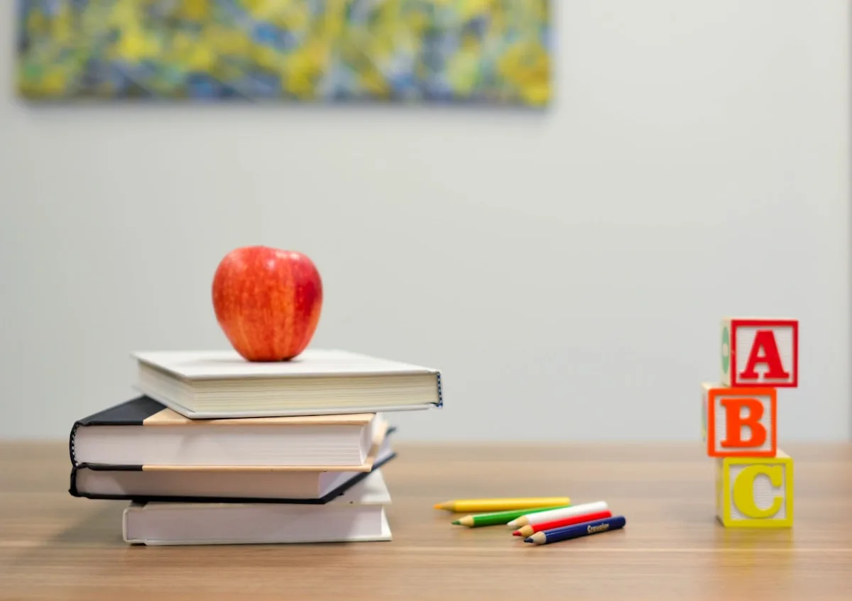 Classroom-style setting with books and writing—illustrative imagery for Newsorga’s explainer on France’s higher non-EU university fees for 2026–27 (not a French campus photograph).