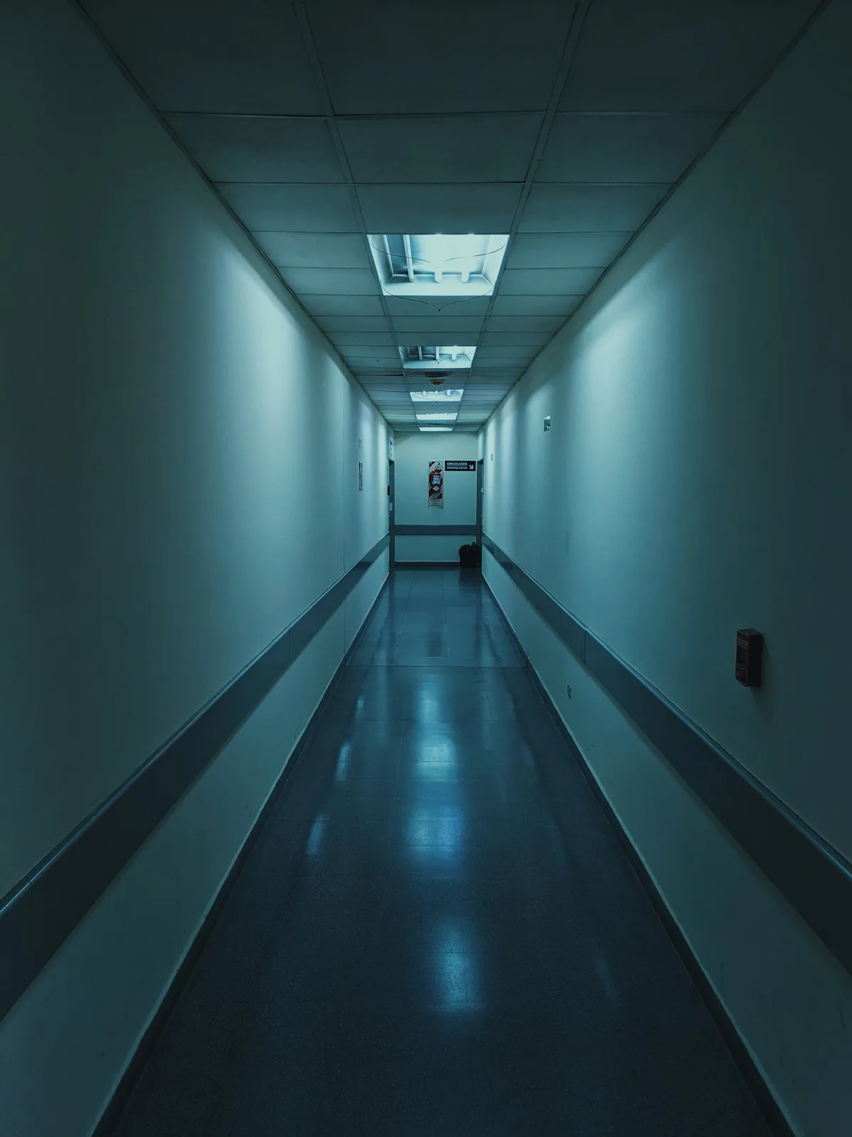 Empty white hospital corridor with overhead lighting — illustrative imagery for reporting on 'Gaza: Doctors Under Attack', the Basement Films documentary about Palestinian medics that the BBC dropped in June 2025, Channel 4 aired in July 2025, and which won the BAFTA TV Award for Current Affairs at London's Royal Festival Hall on Sunday, May 10, 2026.