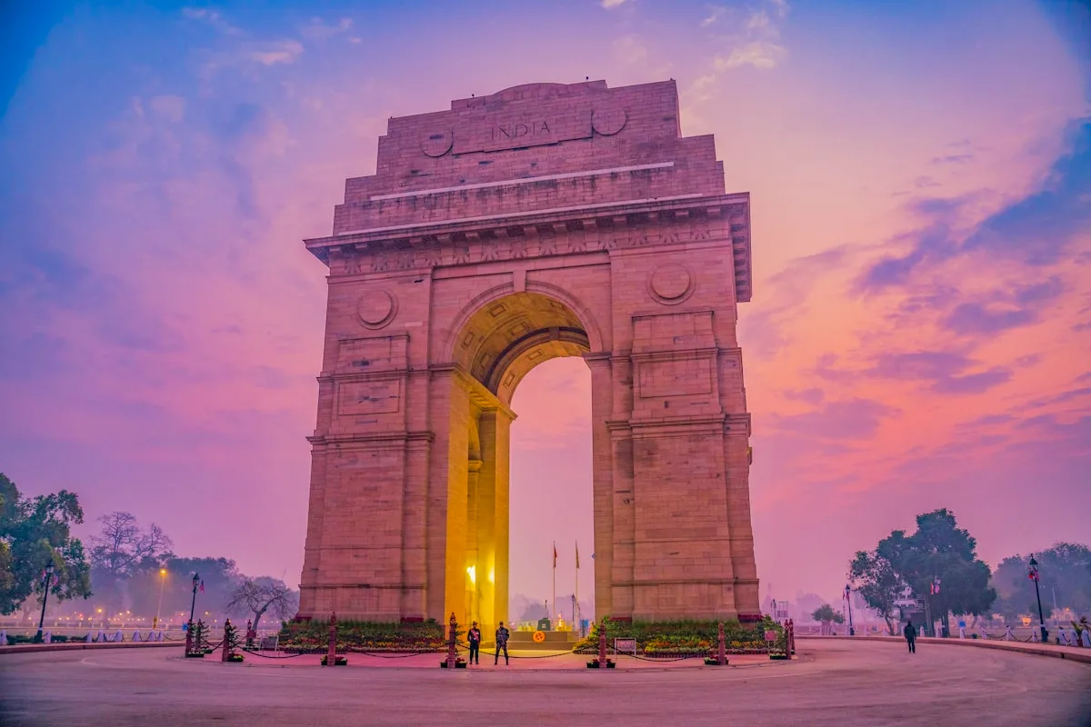 The India Gate monument in New Delhi under a clear daytime sky — illustrative imagery for Newsorga's coverage of Iran's possible attendance at the May 14-15, 2026 BRICS Foreign Ministers' Meeting hosted by India under its 2026 BRICS presidency, with Foreign Minister Seyed Abbas Araghchi's visit kept 'on his agenda' though Deputy Foreign Minister Kazem Gharibabadi is now expected to lead the Iranian delegation.