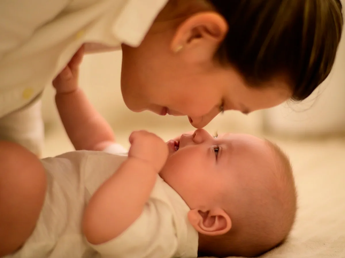 Mother holding her child in an outdoor portrait
