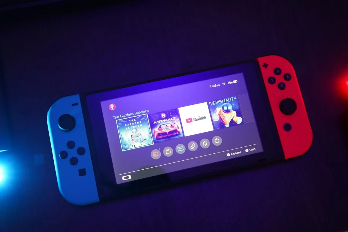 Video game controller and handheld gaming concept still life (not Nintendo product photography)