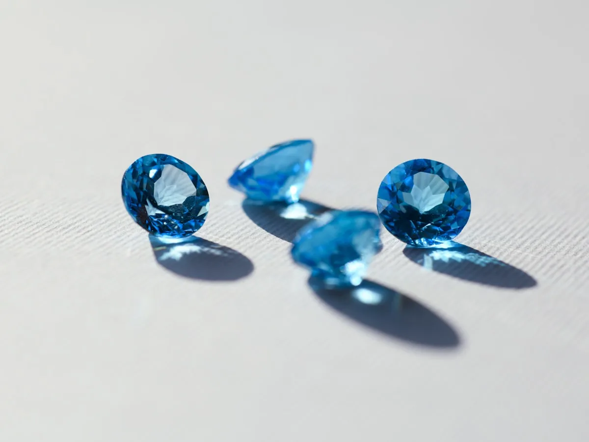 A faceted vivid-blue gemstone laid on a pale surface — illustrative imagery of the 41.82-carat Type IIb fancy blue diamond recovered at South Africa's Cullinan Mine and announced by Petra Diamonds on January 13, 2026, which the AIM-listed miner has now sold via competitive tender as disclosed in its Q3 FY 2026 results in early April 2026.