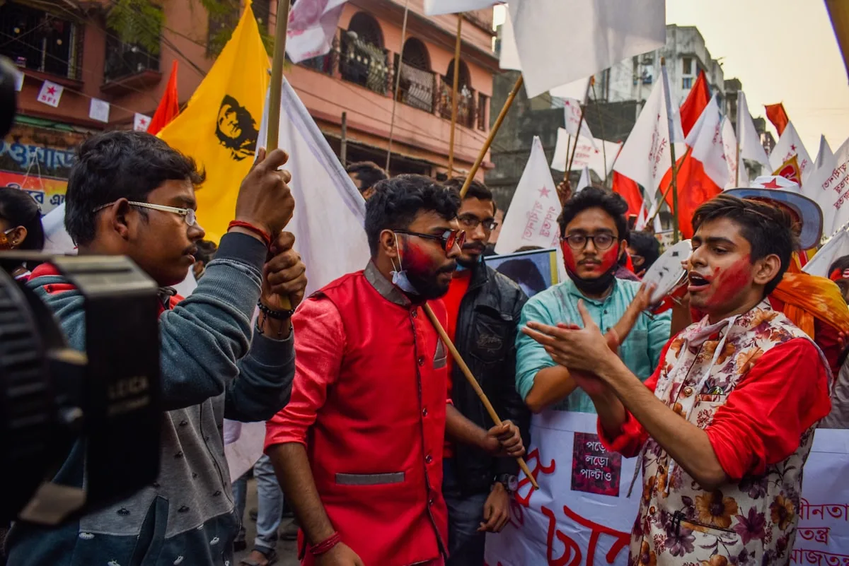 Crowd with flags during a public gathering in Kolkata, West Bengal