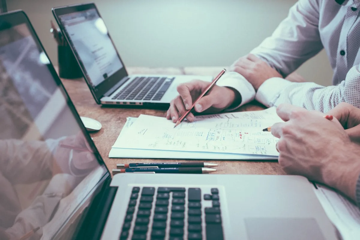 Business meeting table with trade documents and charts